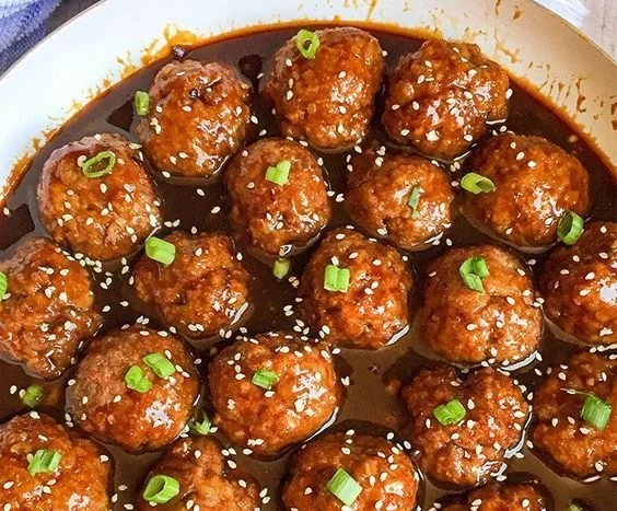 Asian glazed meatballs cooked to perfection with a rich, flavorful sauce.