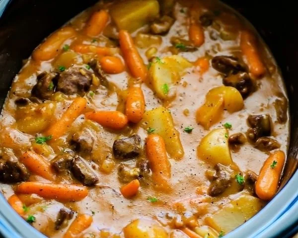A comforting bowl of beef stew with tender meat and vegetables.