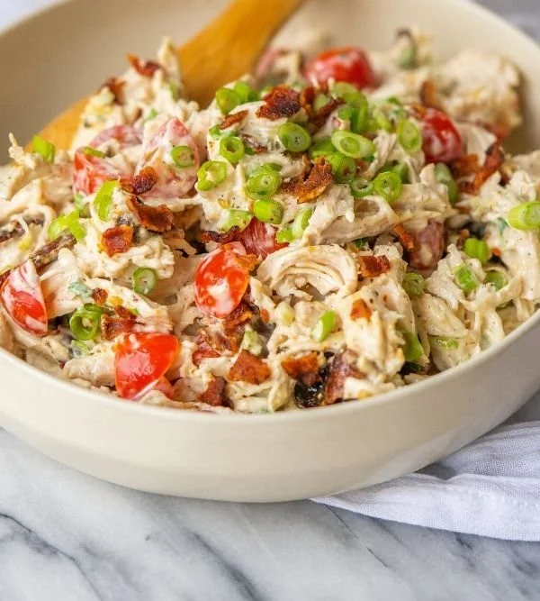 Fresh BLT Chicken Salad with bacon, lettuce, tomato, and grilled chicken on a plate