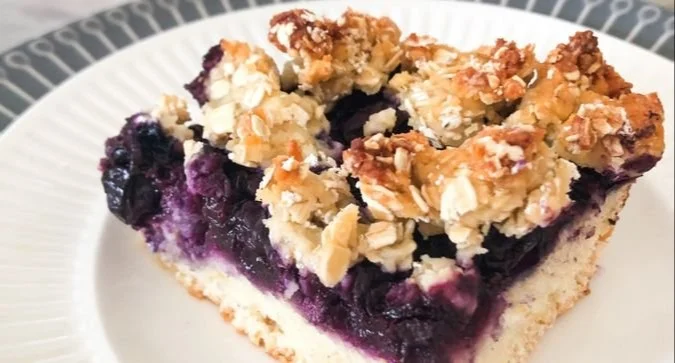 Delicious Blueberry Oat Crumble Bars on a wooden plate