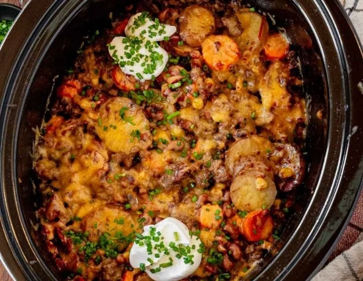 Delicious Cowboy Casserole served in a rustic dish with toppings.