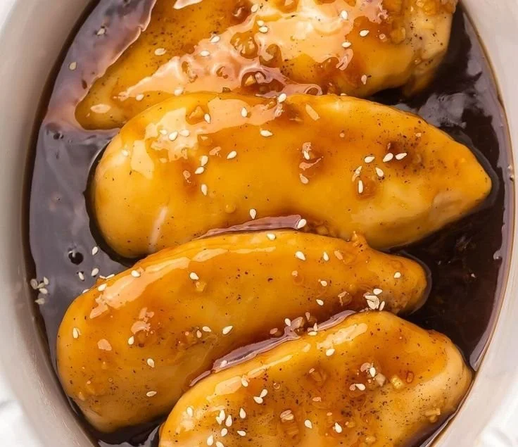 Crock Pot Honey Garlic Chicken served with vegetables in a bowl