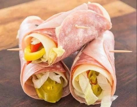 Grain-Free Italian Sub Roll-Up with fresh ingredients on a plate.