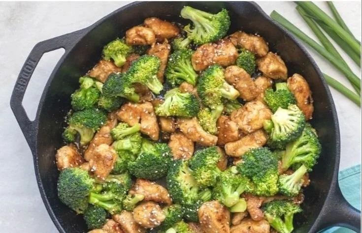 Plate of Honey Sesame Chicken with Broccoli served with rice