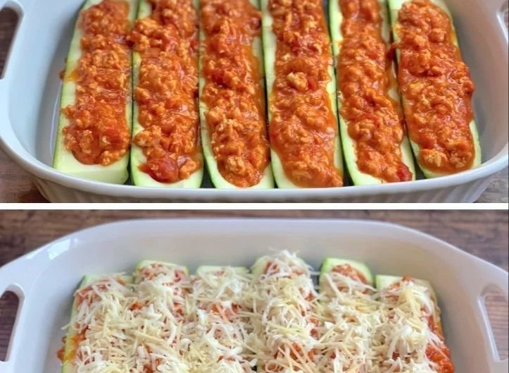 Low-Carb Chicken Parmesan Zucchini Boats topped with cheese and herbs