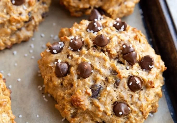 Baked Peanut Butter Protein Cookies on a cooling rack, healthy snack option.