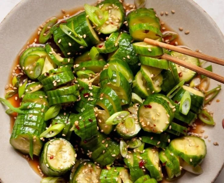 Spicy cucumber salad with fresh vegetables in a bowl