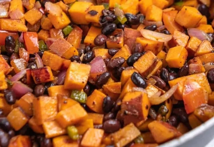 Colorful Sweet Potato Breakfast Hash with veggies and spices in a skillet