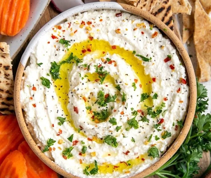 Creamy whipped feta dip served with fresh vegetables and crackers